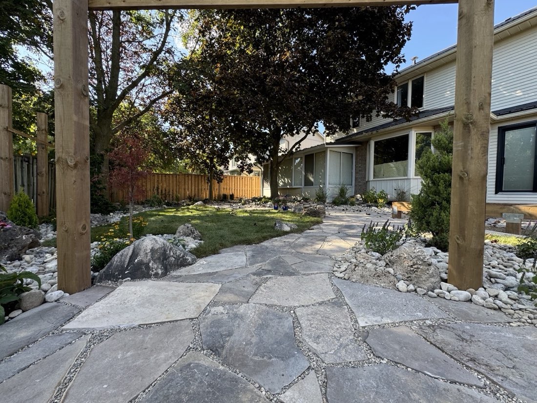 Irregular flagstone path through a garden